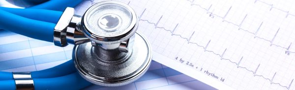 Stethoscope on cardiogram sheet