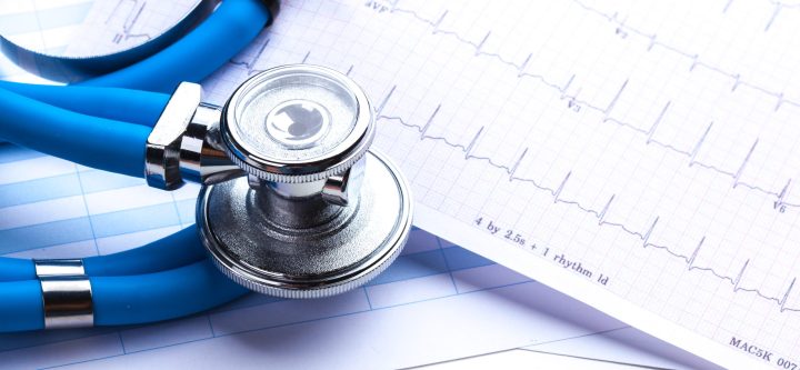Stethoscope on cardiogram sheet